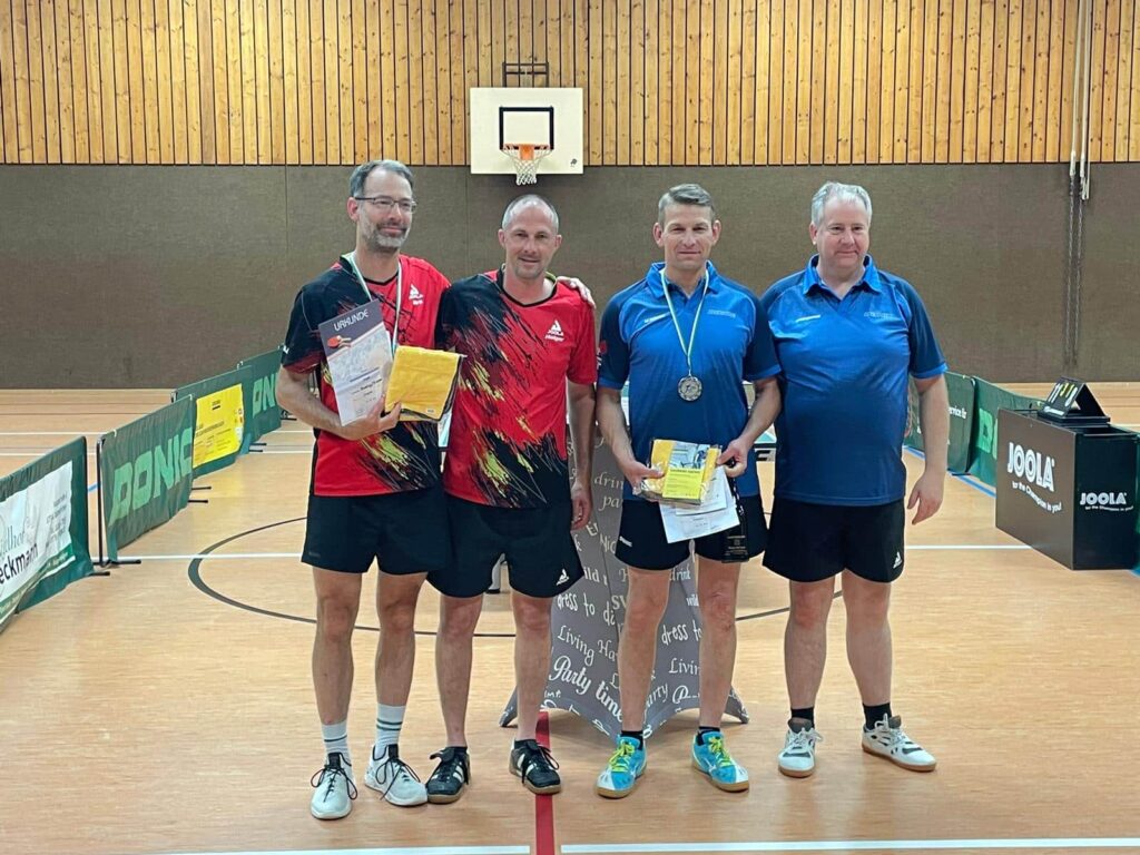 a group of men standing in a gym