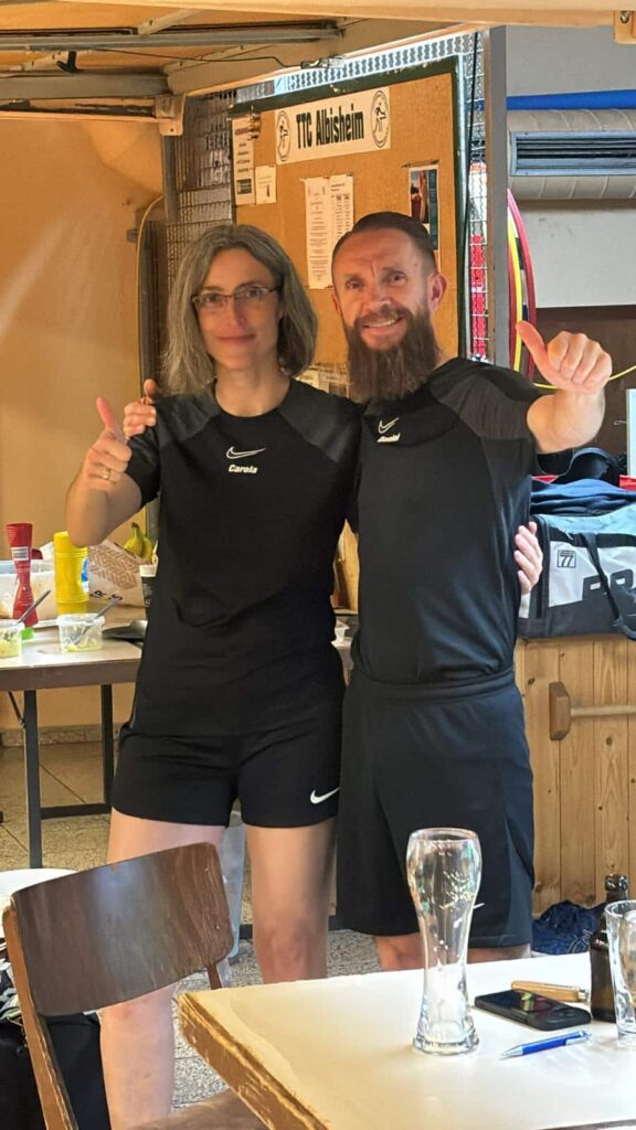 a man and woman standing next to each other