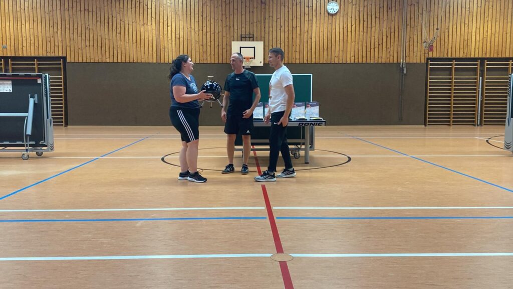 a group of people in a gym