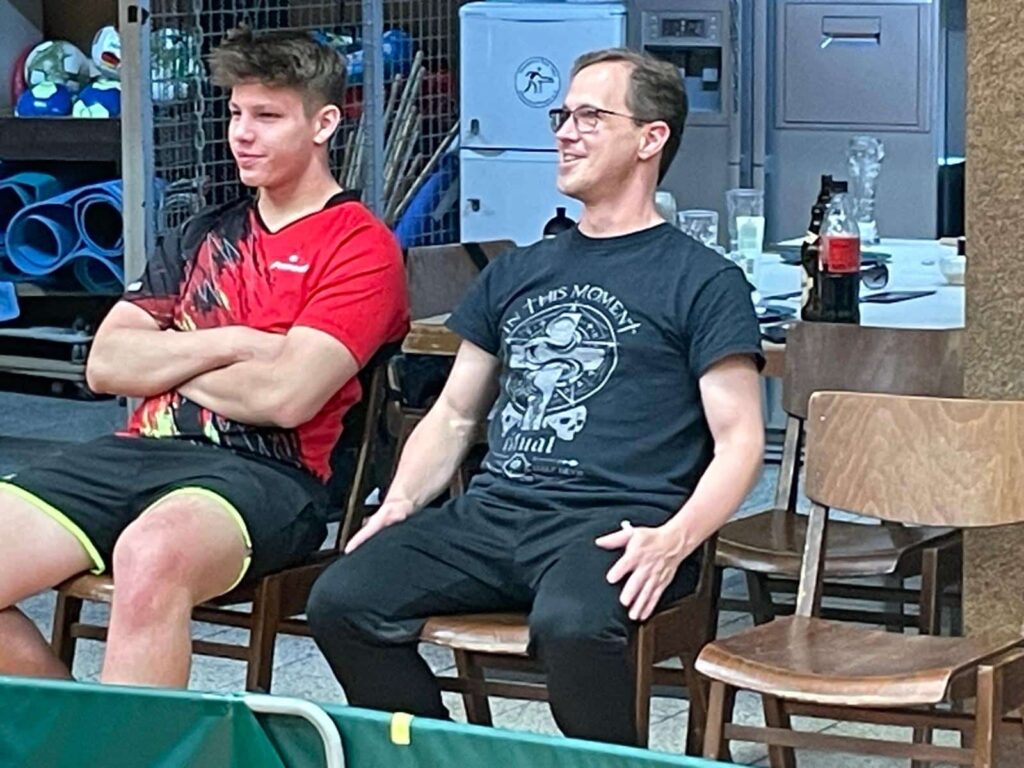 two men sitting in chairs