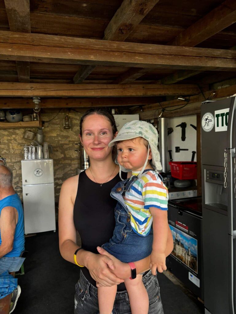 a woman holding a baby