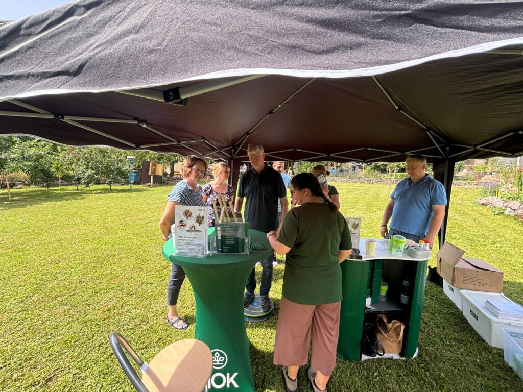 a group of people standing under a tent