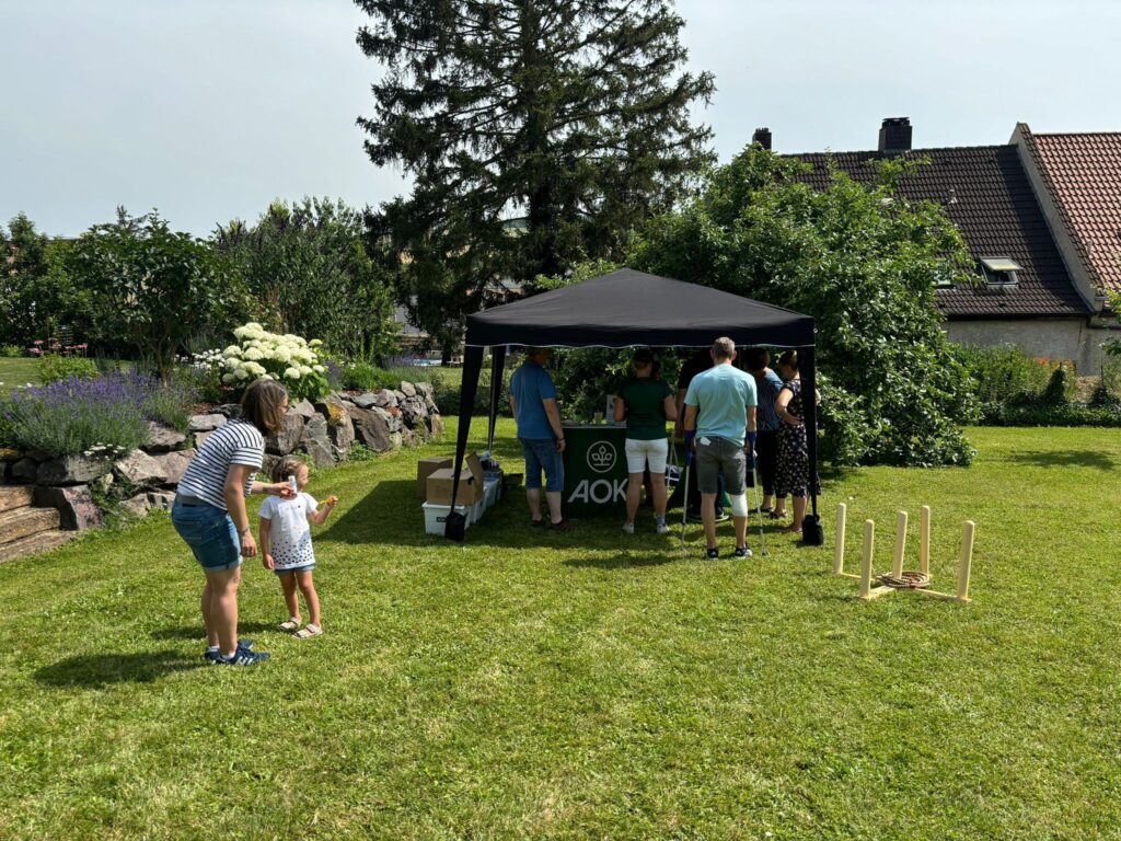 a group of people standing under a tent