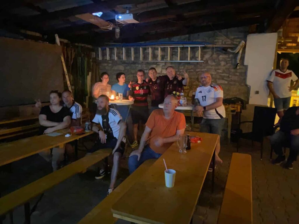 a group of people sitting around tables