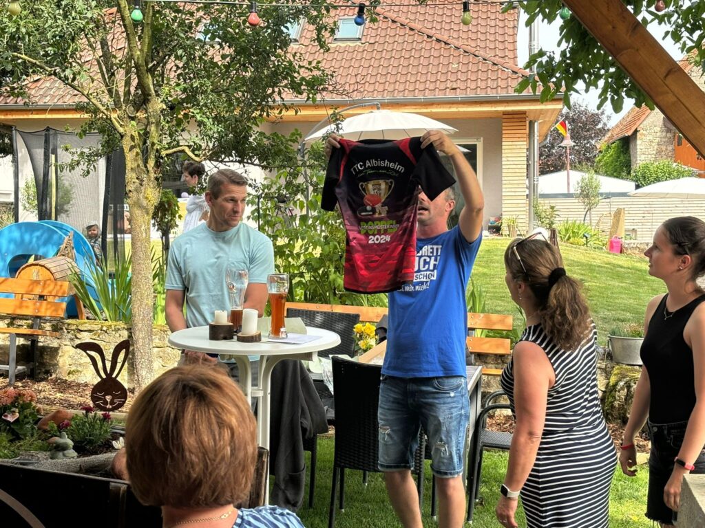 a man holding a shirt