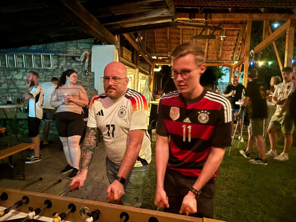 a group of men playing foosball