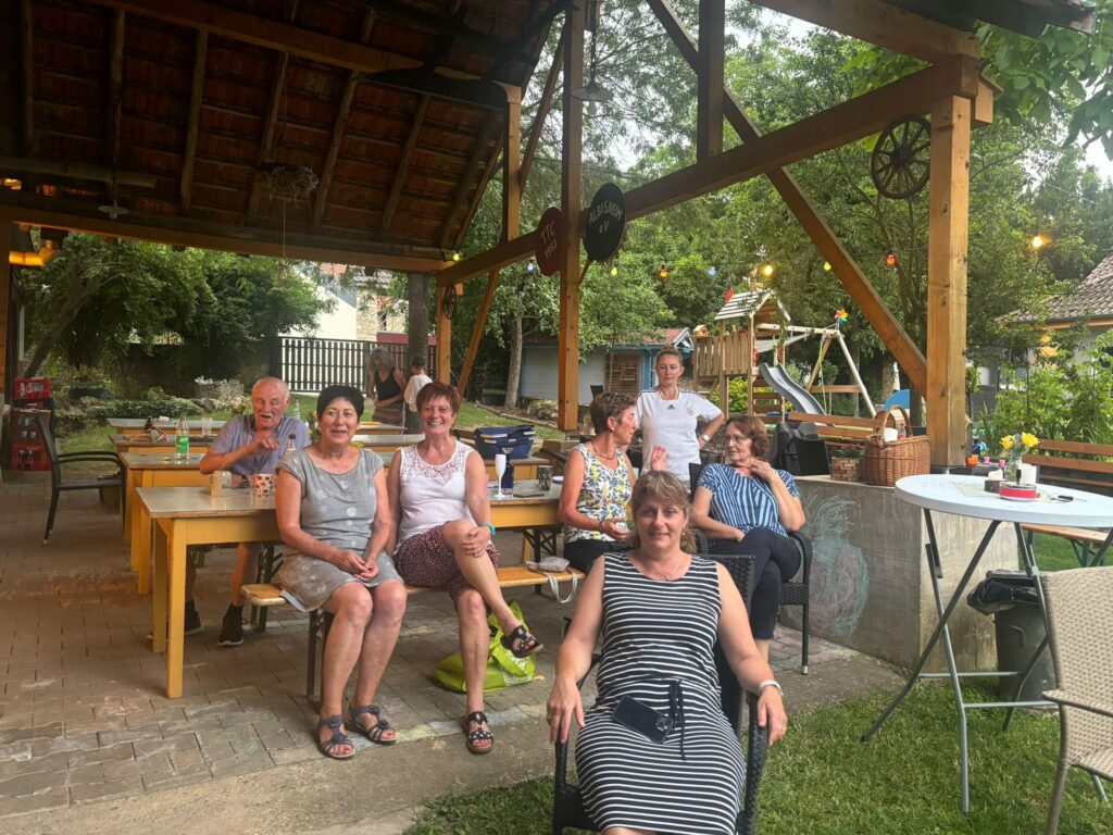 a group of people sitting under a gazebo
