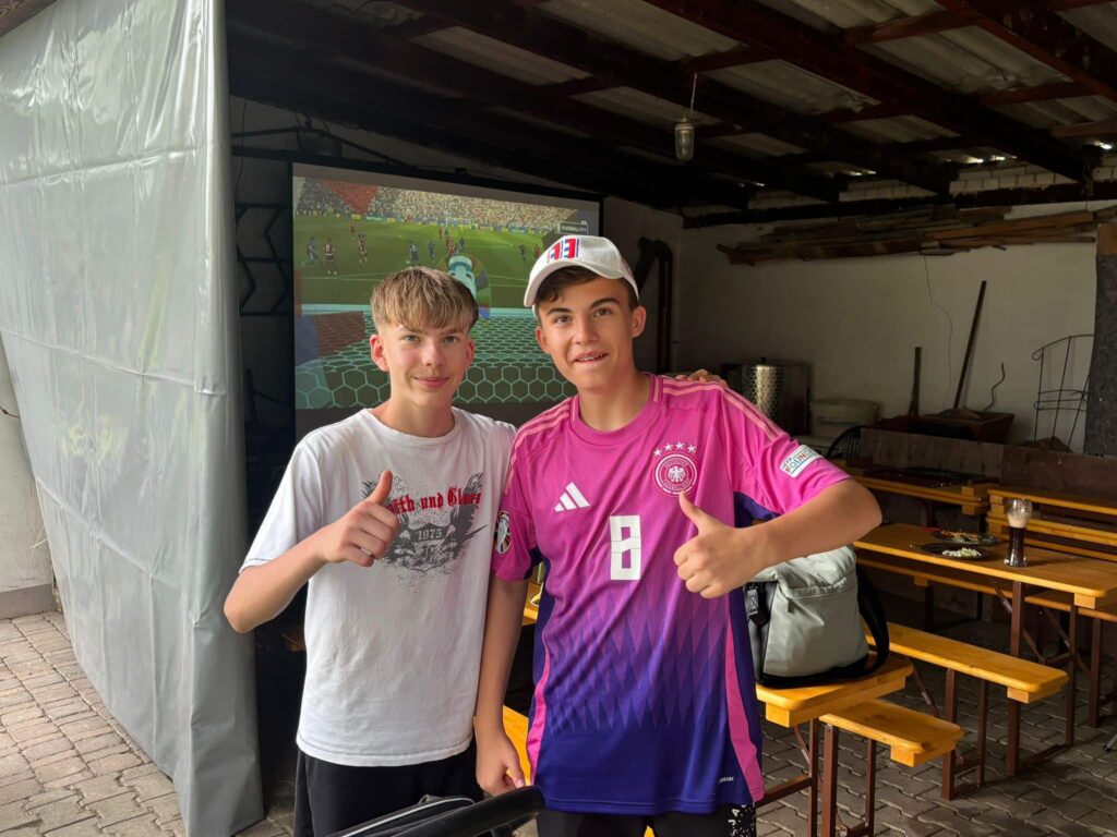 two boys standing next to each other