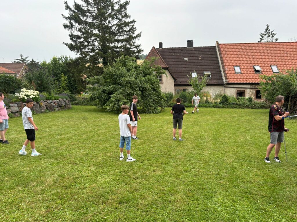 a group of people standing in a yard