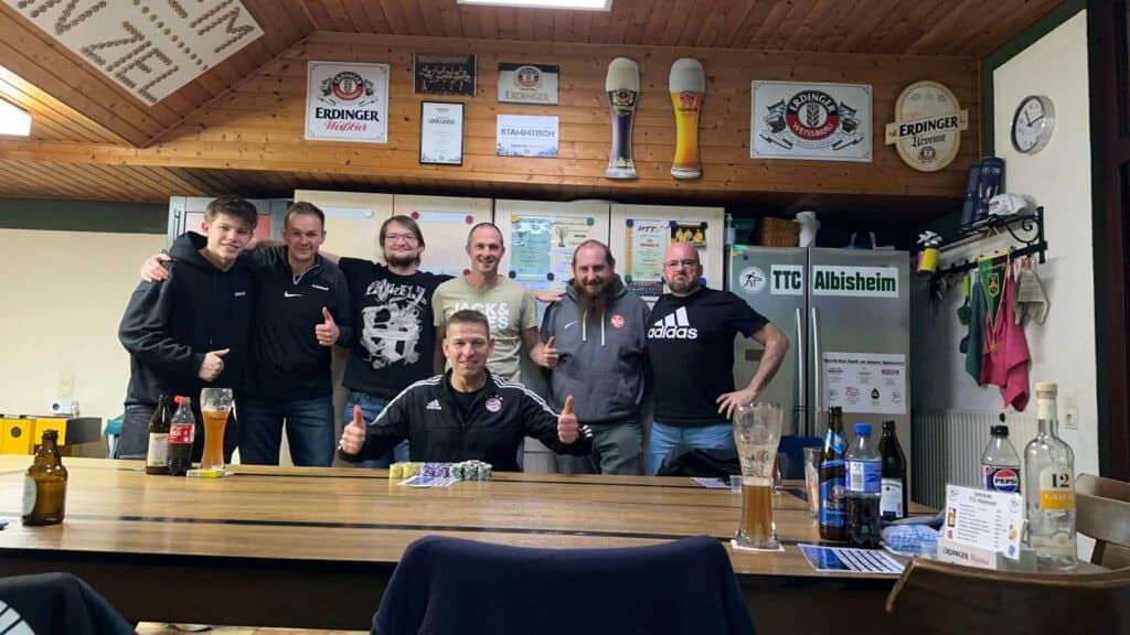 a group of men posing for a picture