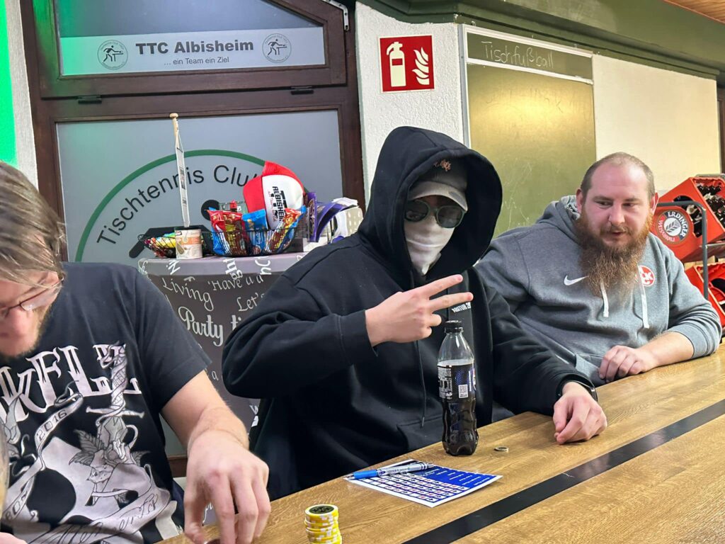 a group of men sitting at a table