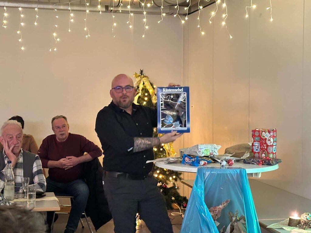 a group of men sitting around a table with a picture of a picture