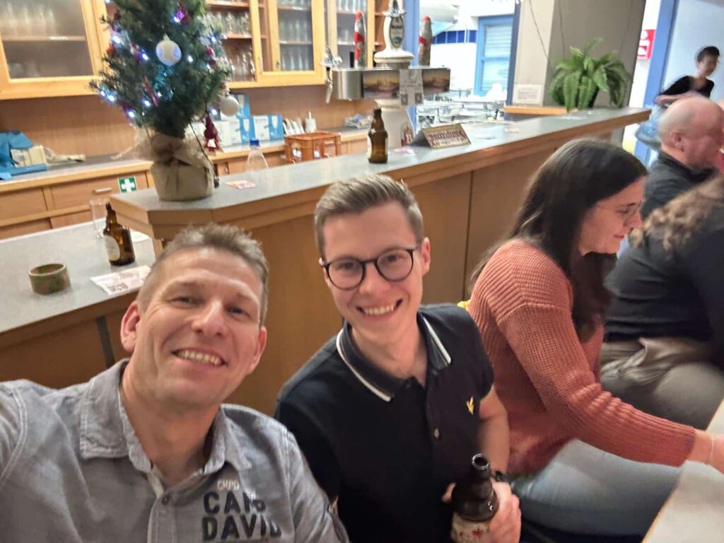 a group of people sitting at a bar
