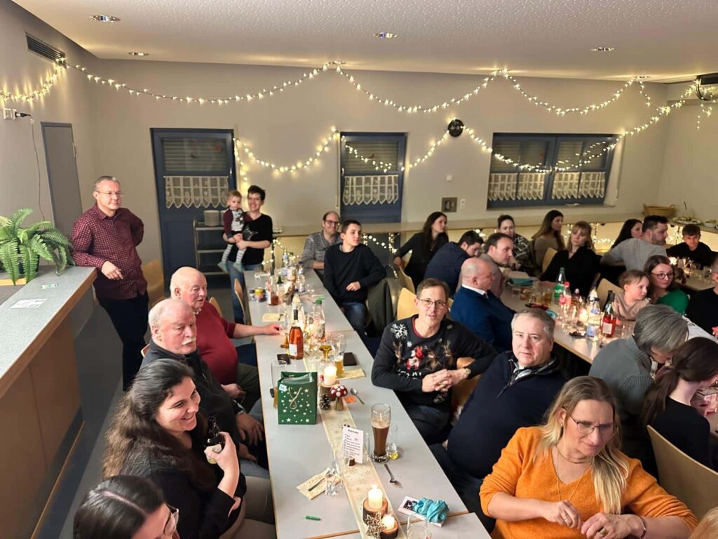 a group of people sitting at long tables