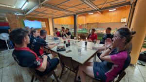 a group of people sitting around a table