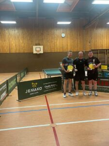 a group of men standing in a court holding yellow discs